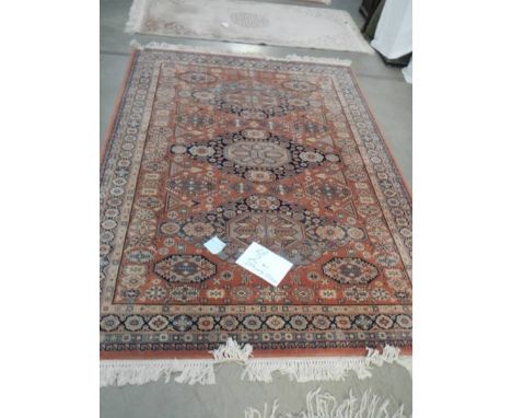A 257 x 170 cm rug including fringe.