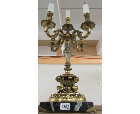 A five light gilded table lamp on marble base (will need re-wiring).