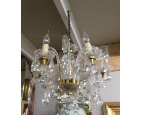 A 5 lamp glass chandelier.