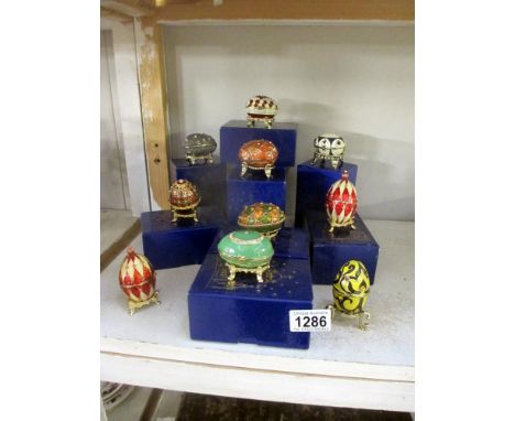 9 boxed Atlas edition eggs trinket holders with certificates and 1 unboxed with no certificate
