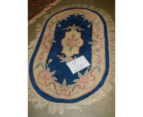 A 165 x 110 cm rug.