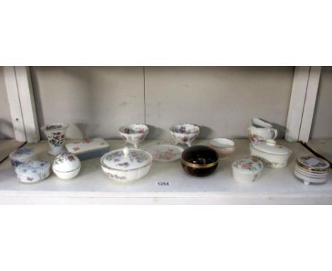 A selection of porcelain trinket boxes including Wedgwood
