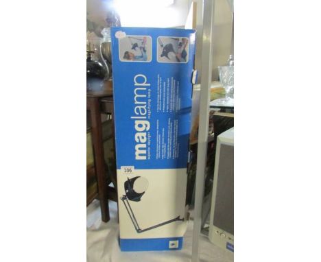 A boxed Maglamp magnifying lamp.