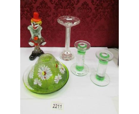 A pair of glass candlesticks, one other, a hand painted tea light and a glass clown.