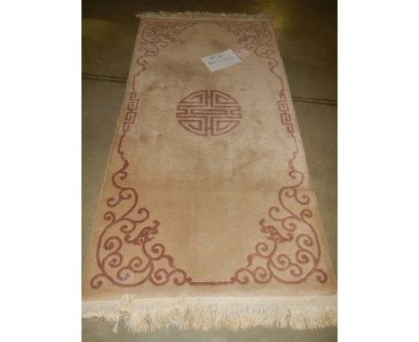 A 210 x 90 cm rug.