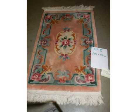 A 180 x 84 cm rug.