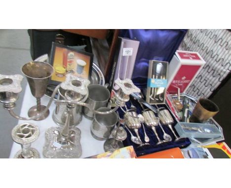 A mixed lot of silver plate including candelabra, goblets etc.,