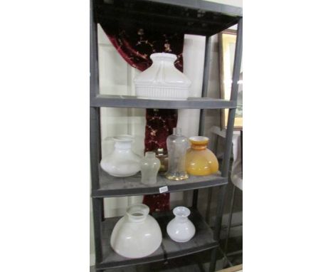 A quantity of oil lamp and other shades.