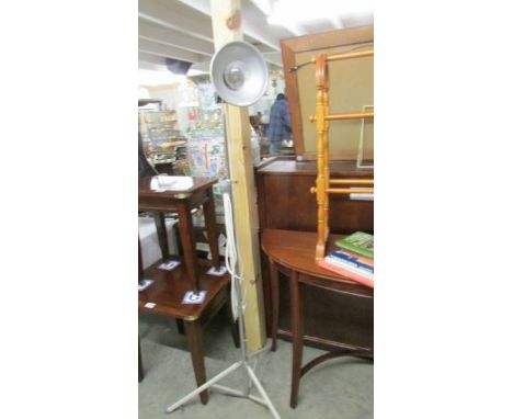 A floor standing adjustable reading lamp.