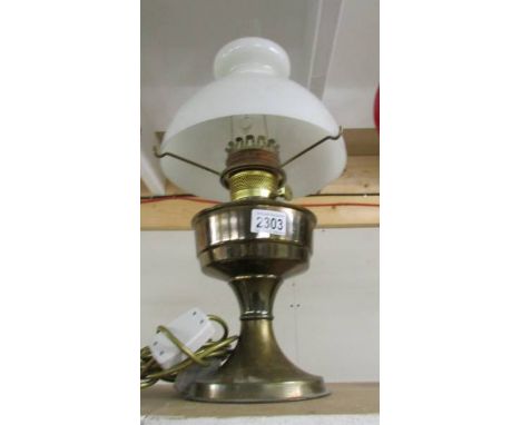 A brass oil lamp.