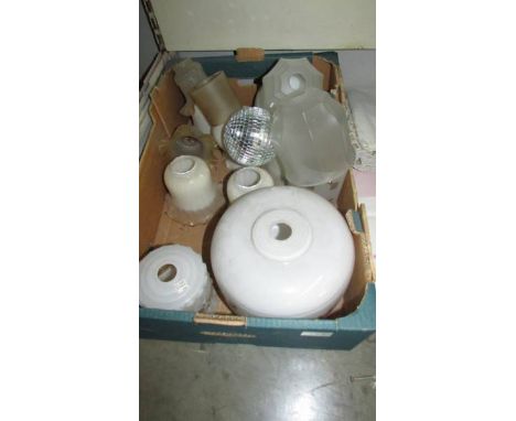 A box of glass lamp shades.