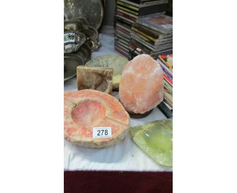 A crystal lamp, stone ashtrays etc.,