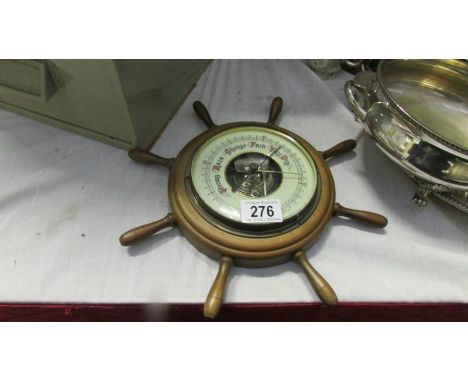 A ships wheel barometer.