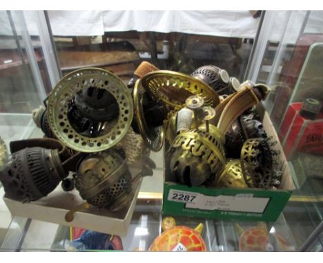 A quantity of oil lamp burners and galleries.