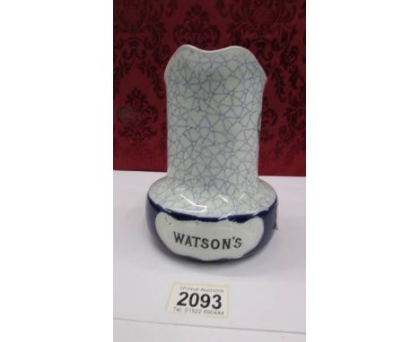 A Watson's blue band whiskey water jug.  Decorated blue &amp; white design with raised area to front with WATSON'S Dundee mar