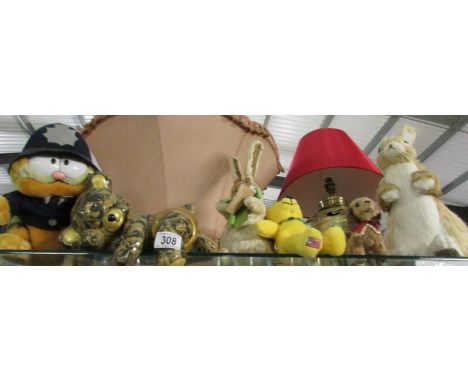 A mixed lot of rabbit figures, ceramic bear and soft toys.
