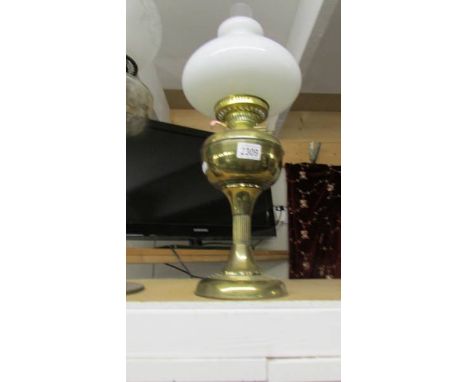 A brass oil lamp.