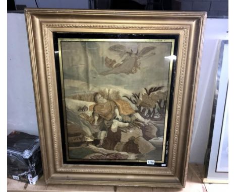 A large gilt framed tapestry of a human sacrifice A/F size 86cm x 74cm approx.