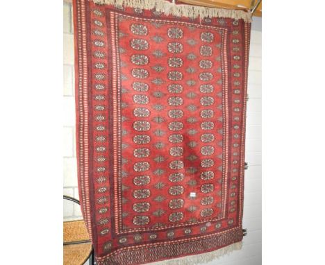 A 180 x 125 cm close woven rug.