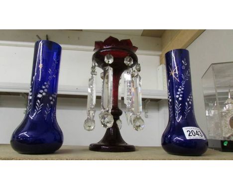 A pair of blue glass hand painted vases and a ruby glass lustre.