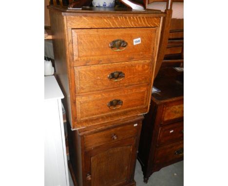 A solid oak 3 drawer chest and a 1930's oak pot cupboard