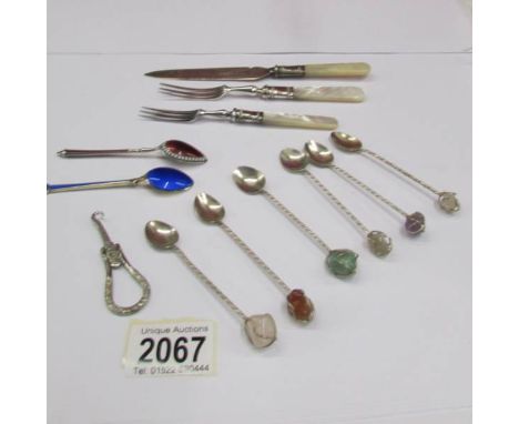 A set of 6 stone set coffee spoons, 2 enamel spoons, a butter knife, 2 pickle forks and a button hook.