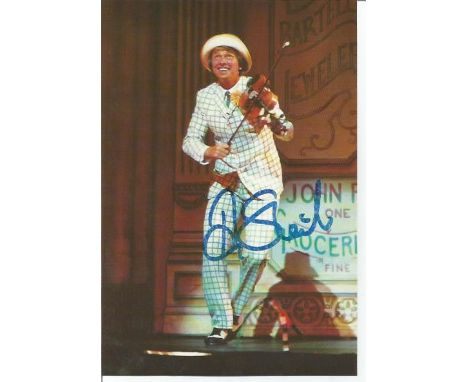 Tommy Steele signed 6x4 colour photo. English entertainer, regarded as Britains first teen idol and rock and roll star. Good 