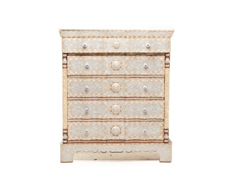 A SYRIAN MOTHER OF PEARL AND BONE INLAID CHEST OF DRAWERS
With shaped white marble top above an arrangement of drawers, flank
