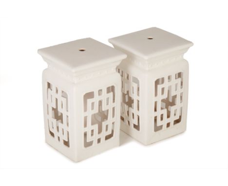 A PAIR OF SQUARE WHITE CERAMIC STOOLS
With openwork sides
46cm high x 29cm wide
Condition: Minor signs of wear commensurate w