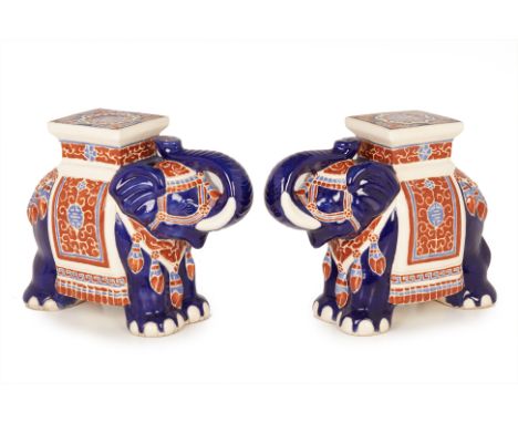 A PAIR OF ORIENTAL CERAMIC ELEPHANT STOOLS
Modelled with their trunk raised, with a howdah on their back
45cm high x 56cm wid