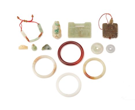 A GROUP OF ASSORTED JADE AND OTHER HARDSTONE ITEMS
Including bangles and pendants
The largest jade plaque 6.5cm x 5cm
Conditi
