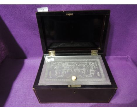 A vintage tea caddy with lacquer case and internal pewter container