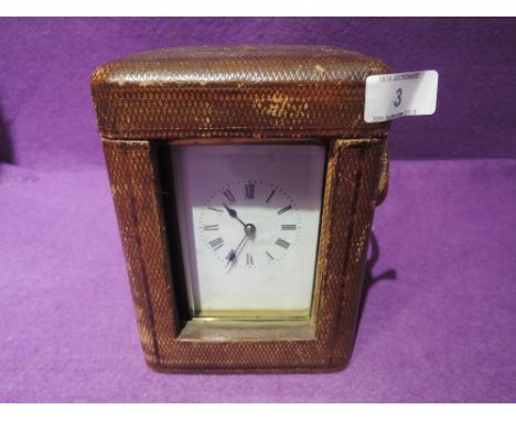 A carriage clock brass and bevel edged French design with fitted caseCONDITION REPORT not tested for functionality, has key a