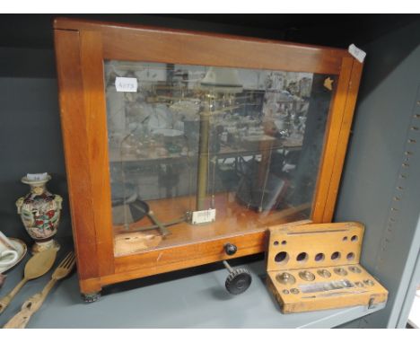 A set of Chemist or similar scientific balance scales and weight set