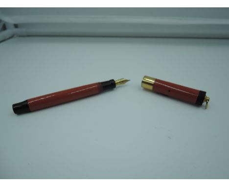 A Parker Lucky Curve Lady Duofold fountain pen, Orange and black hard rubber ringtop, fine nib, button fill, good condition, 