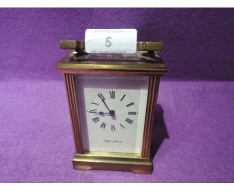 A brass and bevel cut glass carriage clock by Mappin and Webb