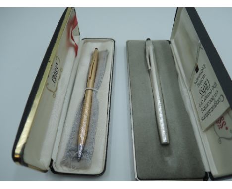 Two boxed Cross pens. A stainless steel fibre tip and a gold coloured ballpoint