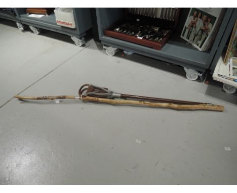 A shooting stick and similar walking cane