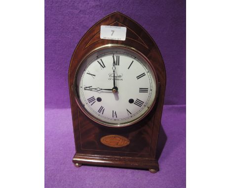 A mantle clock by Elliot in a bishops hat design