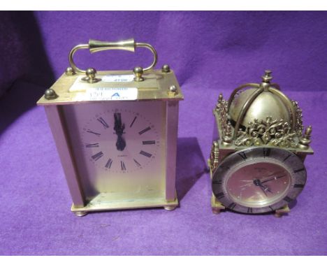 A vintage lantern clock by Swiza and a carriage clock by Estima