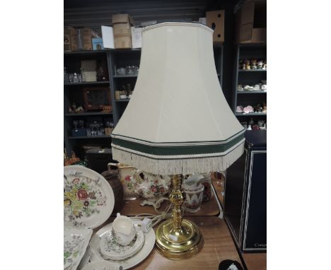 A large brass bodied light base