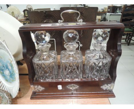 A tantalus and decanter setCONDITION REPORT unmarked and in good condition, unknown type of wood.