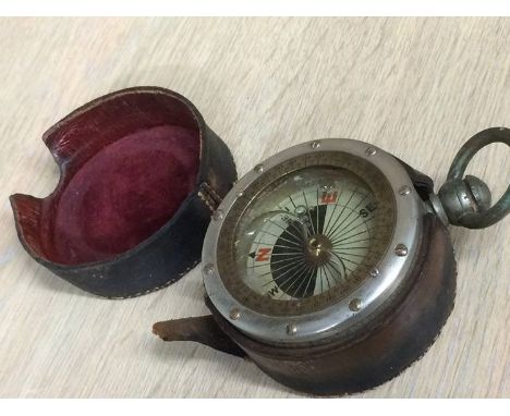 A compass with leather case
