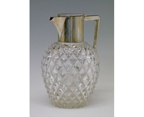 Edward VII cut glass ovoid shaped claret jug having silver mounts hallmarked for Goldsmiths & Silversmiths Co Ltd, London 190