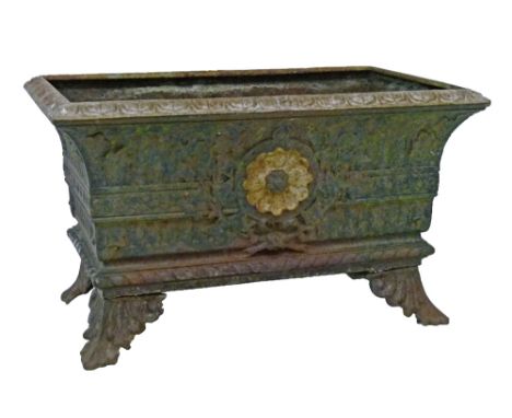 Cast iron rectangular plant trough having stylised foliate decoration and standing on splayed acanthus supports, 62.5cm wide 