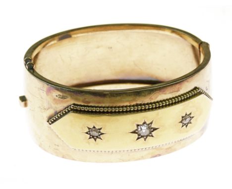 Victorian gold diamond set hinged bangle, the three star set old cut brilliants totalling approximately 0.59 carats, bangle 2