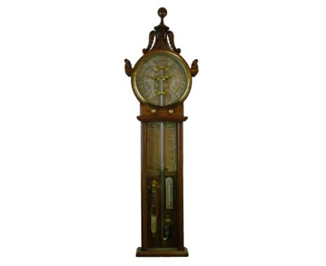 Admiral Fitzroy 'The Atmoscope' oak cased barometer having a carved pediment, circular silvered dial, glazed panel below encl