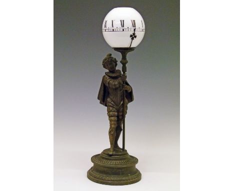 Late 19th/early 20th Century spelter figural night clock formed as a boy dressed in 17th Century costume, the glass shade set
