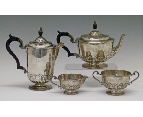 George V silver four piece tea service comprising: teapot, hot water jug, cream jug and two handled sugar basin, each piece w