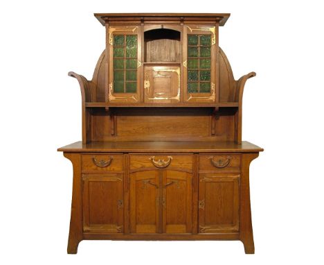 Continental Art Nouveau design oak sideboard, the raised back having a moulded cornice, central open shelf with cupboard door